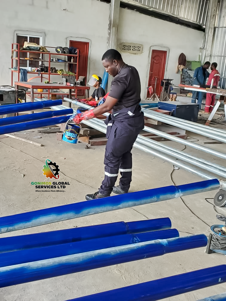 painting of solar street light poles by Gonimos Global